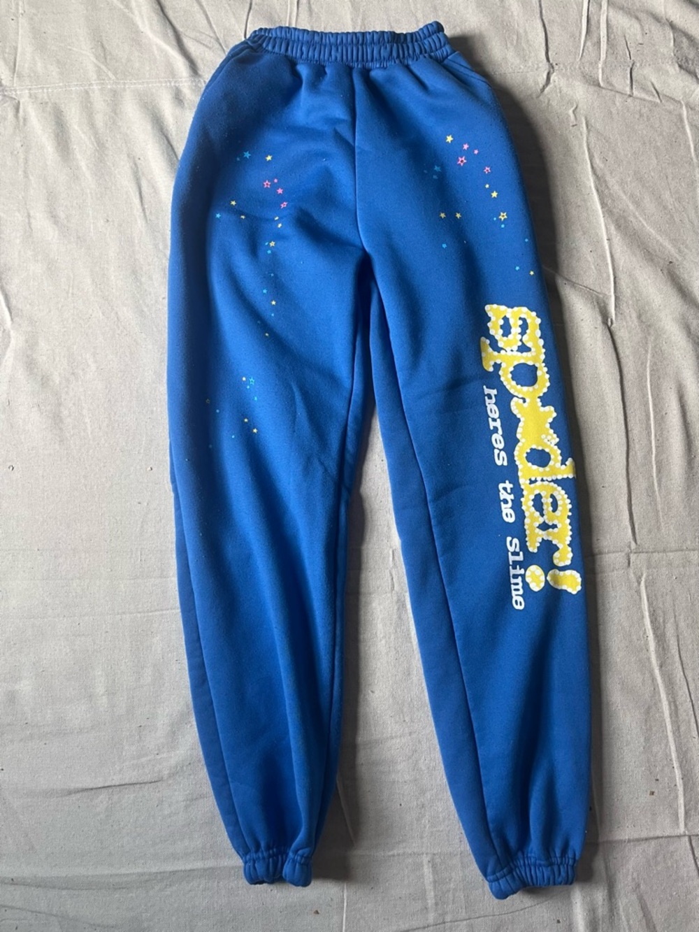 Men’s Blue Sp5der Sweatpants with Yellow 'Splatter' Print